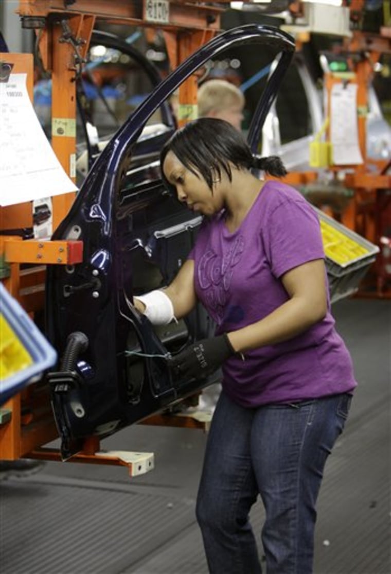 Tasha Livingston installs wiring in a door of a 2011 Chevrolet Cobalt on Tuesday at General Motors' Lordstown Assembly plant in Lordstown, Ohio.